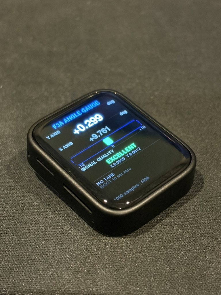 The 2025 WaveShare-based gauge showing a two-axis readout, a bubble-level bar, and a signal-quality indicator reading EXCELLENT.